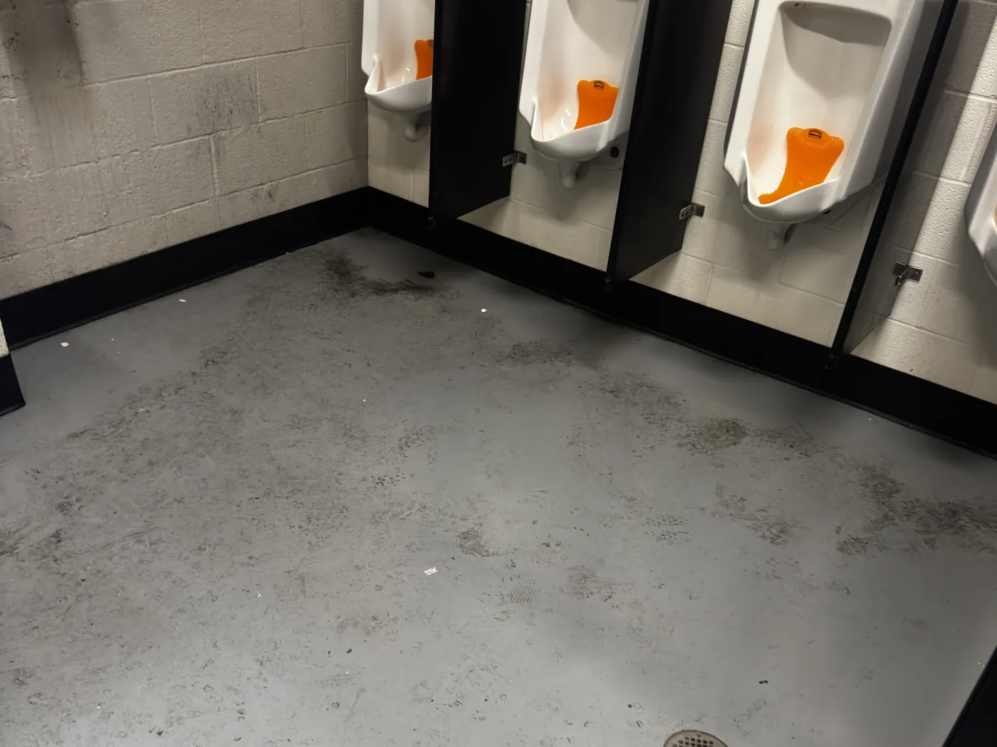 Before: commercial restroom floor prior to cleaning
